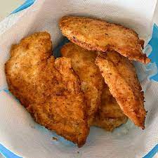 fried chicken spinkled with garlic powder